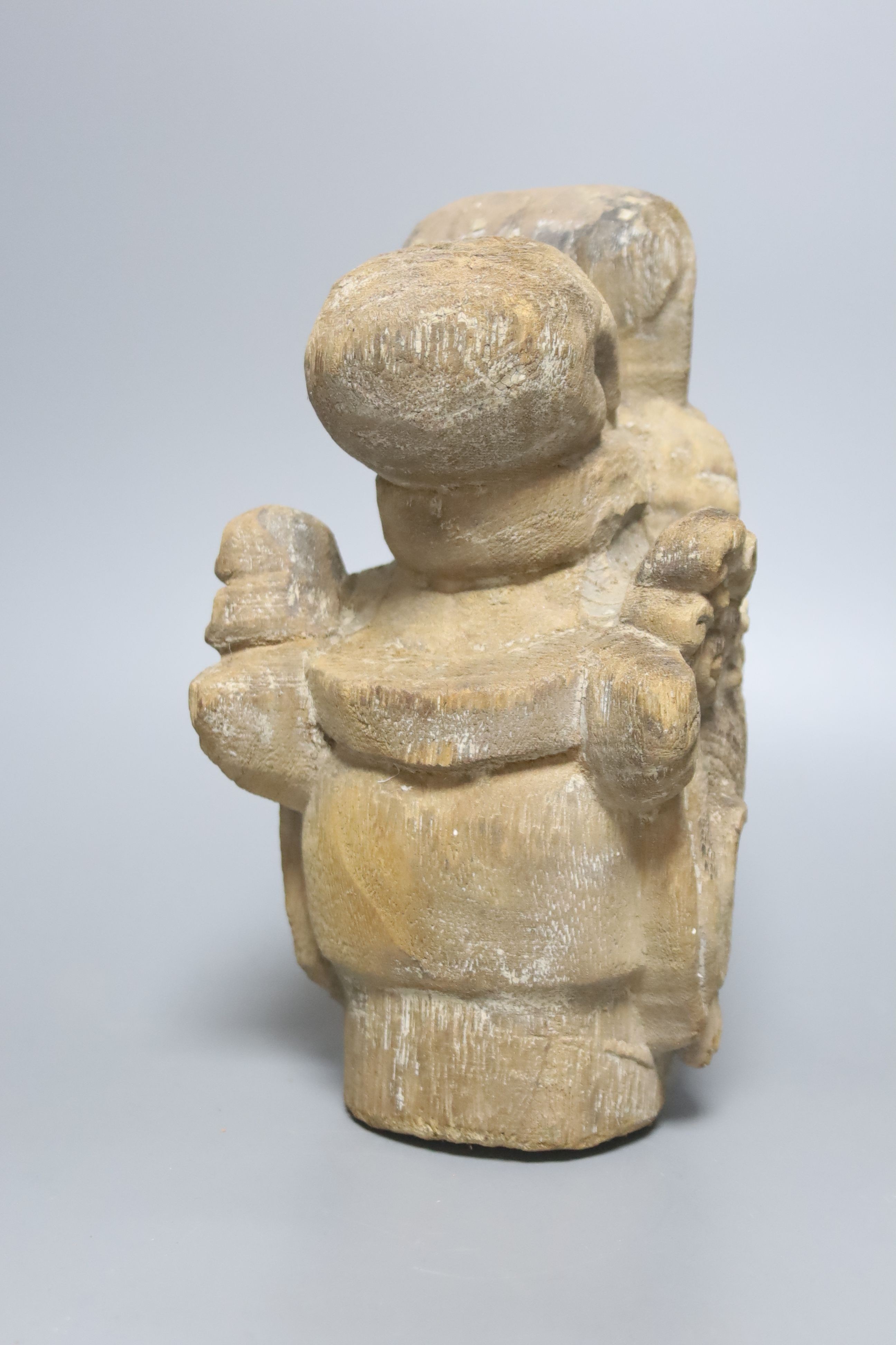 A Chinese carved wood head of Guanyin 24cm